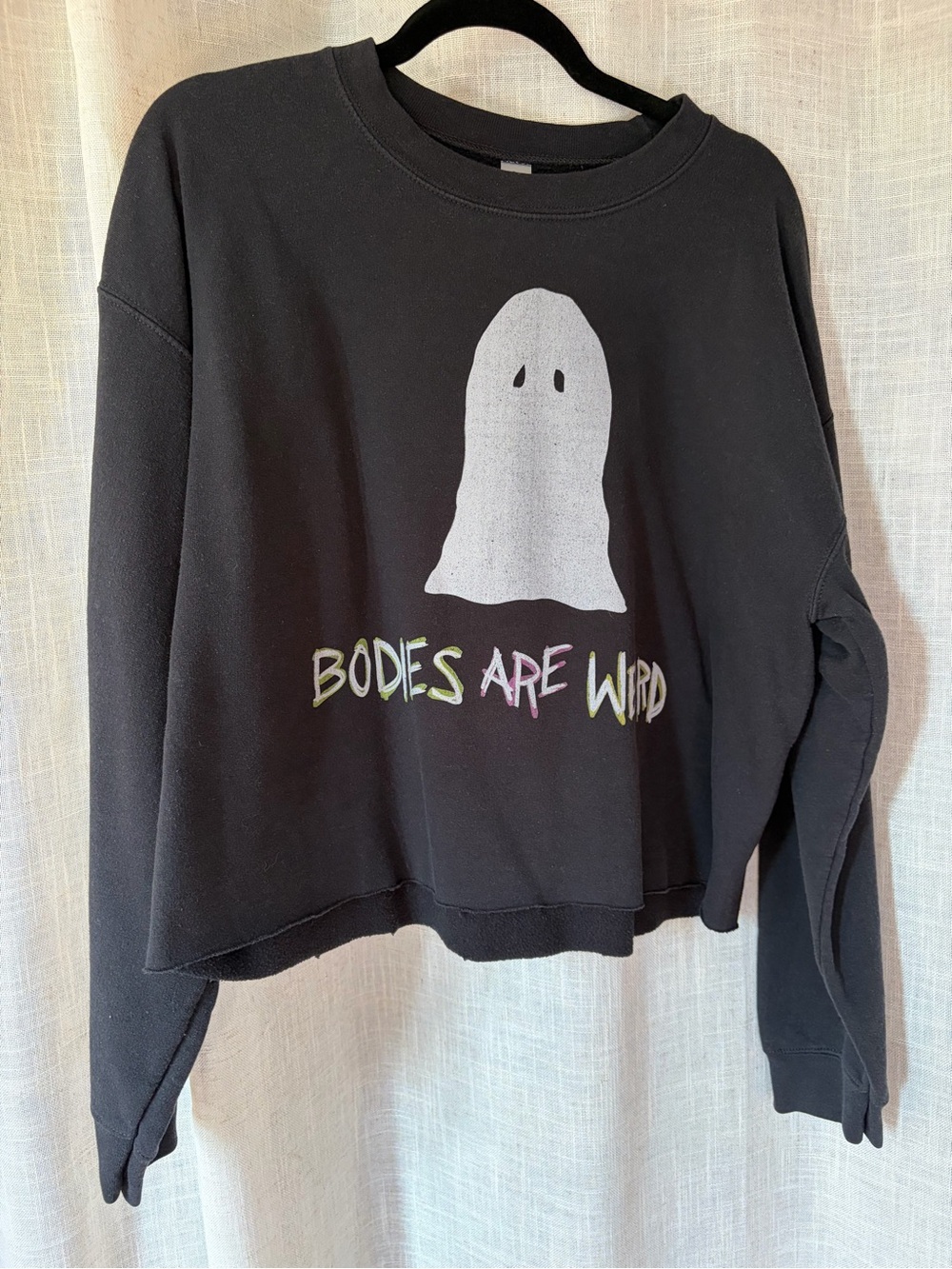 ‘Bodies Are Weird’ Black Cropped Sweatshirt with White Ghost Graphic